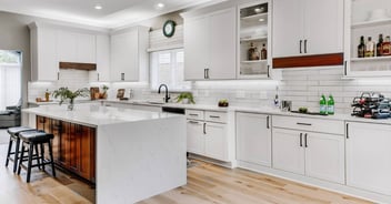 Modern custom kitchen remodel with white shaker cabinets and quartz waterfall island by Cabinet Creations in Bloomfield Hills, MI