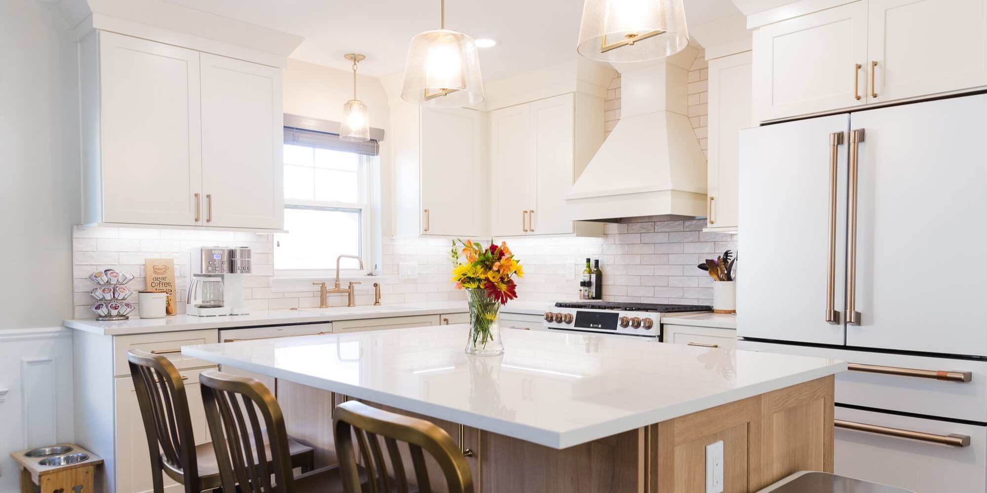 Bright custom kitchen remodel with white cabinets and large island by Cabinet Creations in Oakland County, MI