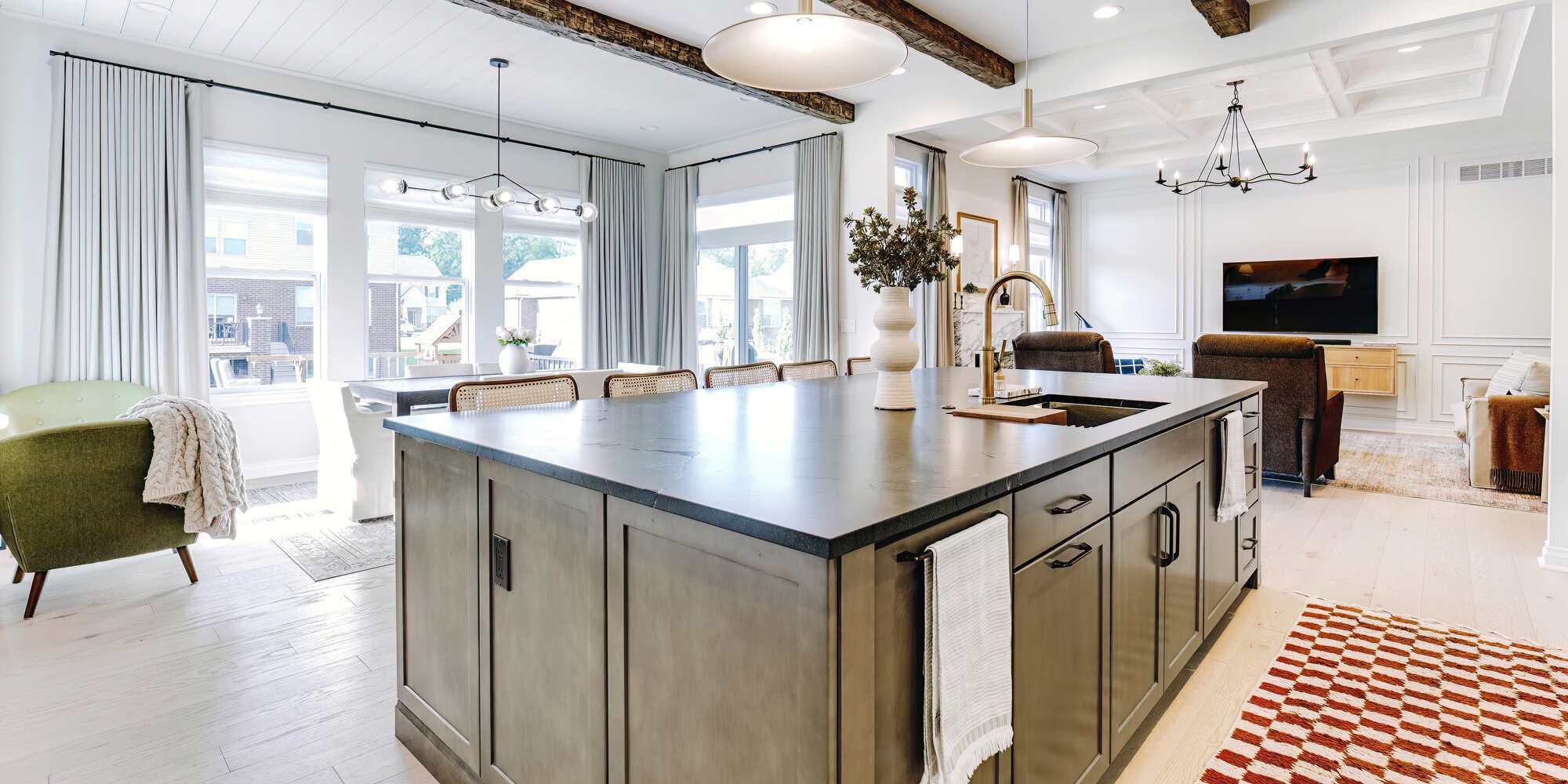 Bright transitional kitchen design in Oakland County, Michigan featuring white cabinets and brass hardware by Cabinet Creations