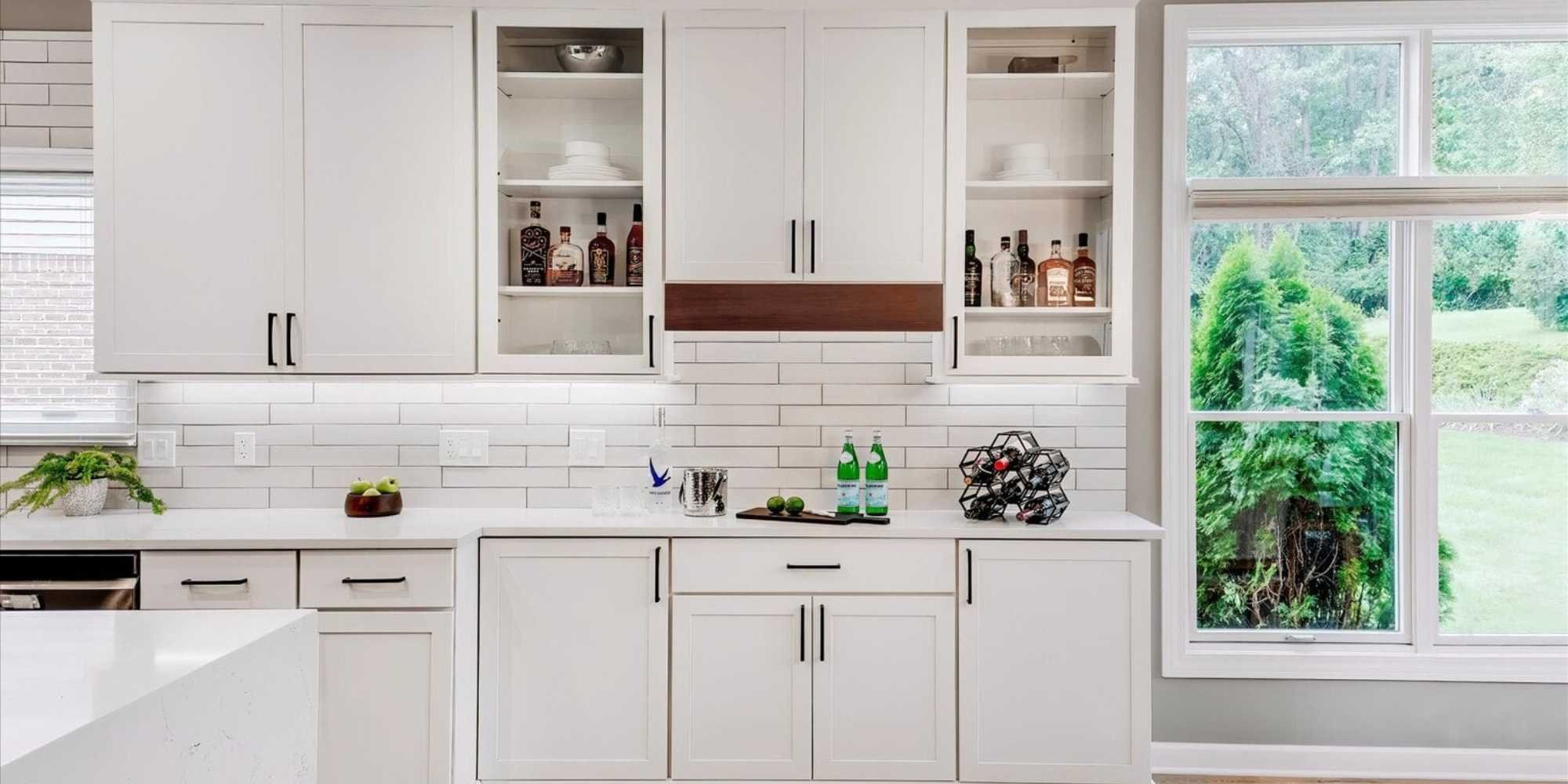 Image of custom white cabinetry with subway tile backsplash in Oakland County, MI by Cabinet Creations