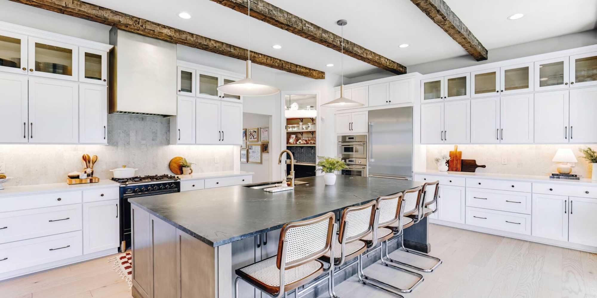Image of custom white kitchen cabinetry with oversized island in Oakland County, MI by Cabinet Creations