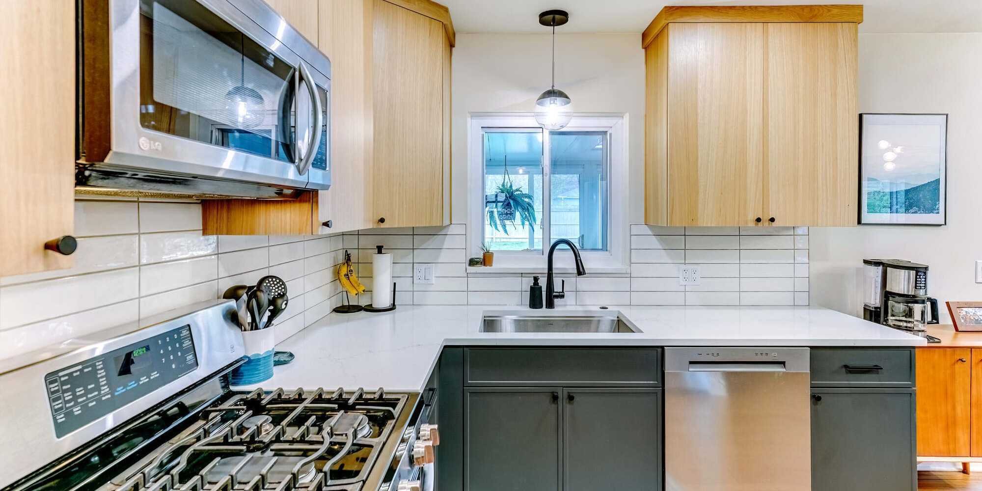 Photo of modern custom cabinetry with two-tone kitchen design in Oakland County, MI by Cabinet Creations