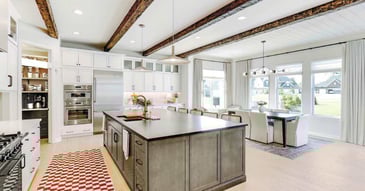 Cabinet Creations kitchen remodel in Oakland County, MI with white perimeter cabinets and dark gray island