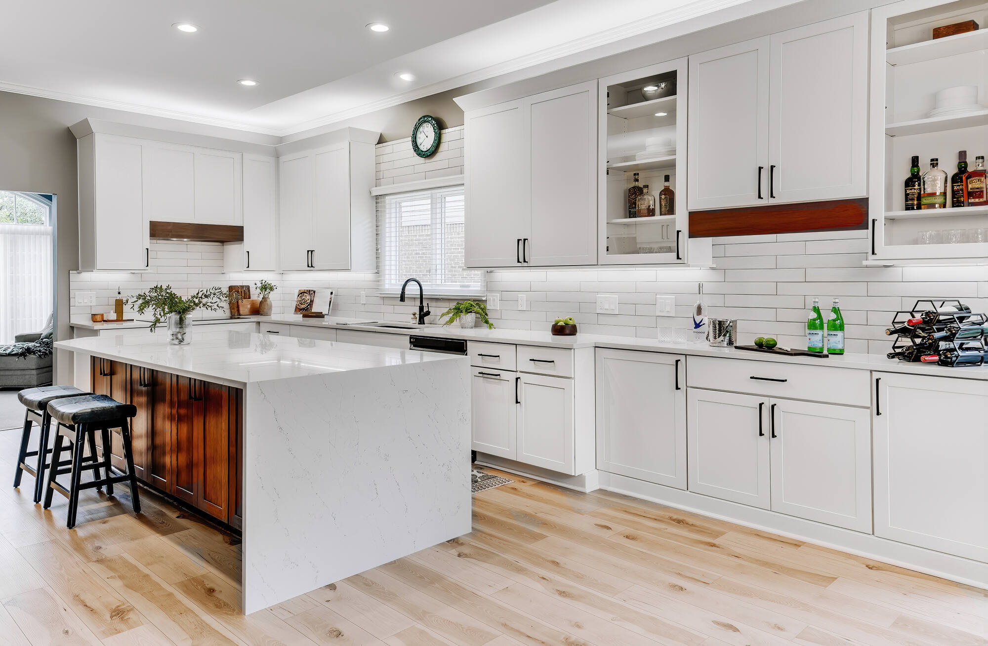 Modern custom kitchen remodel with white shaker cabinets and quartz waterfall island by Cabinet Creations in Bloomfield Hills, MI
