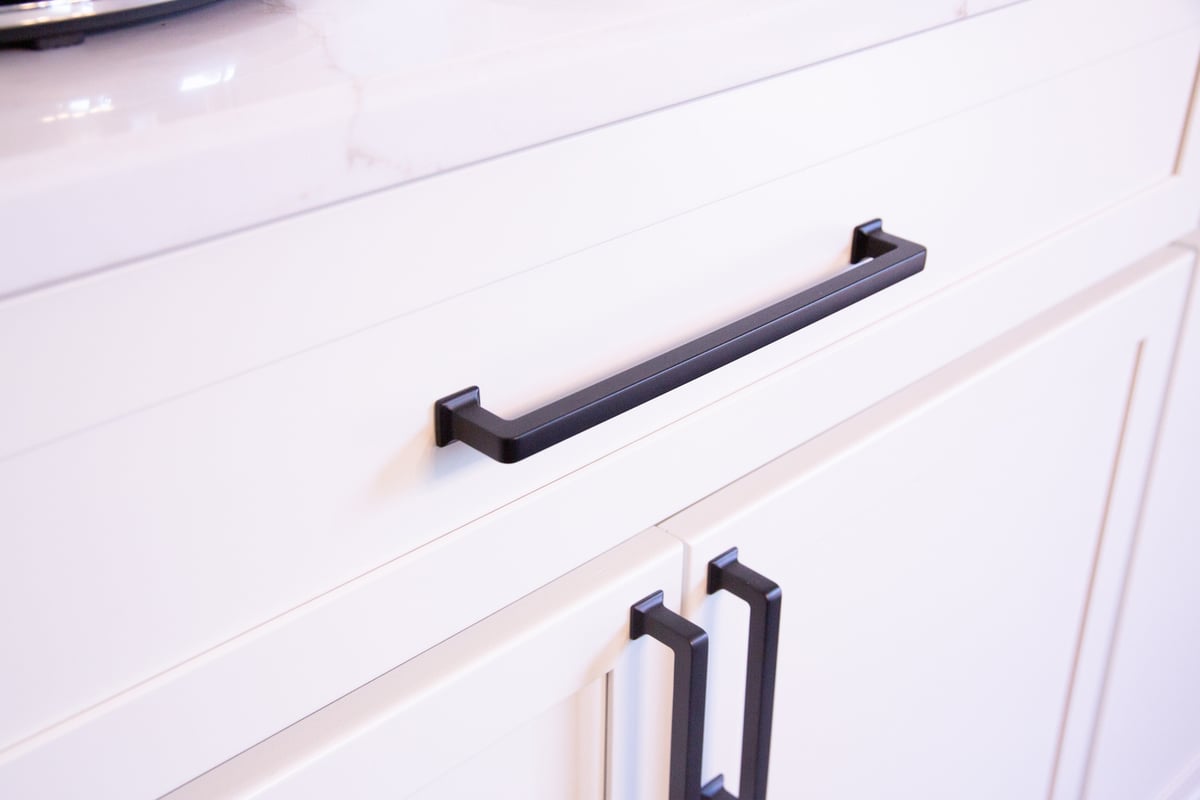 Close-up of modern black drawer pulls on custom cabinetry by Cabinet Creations in Waterford Township, MI
