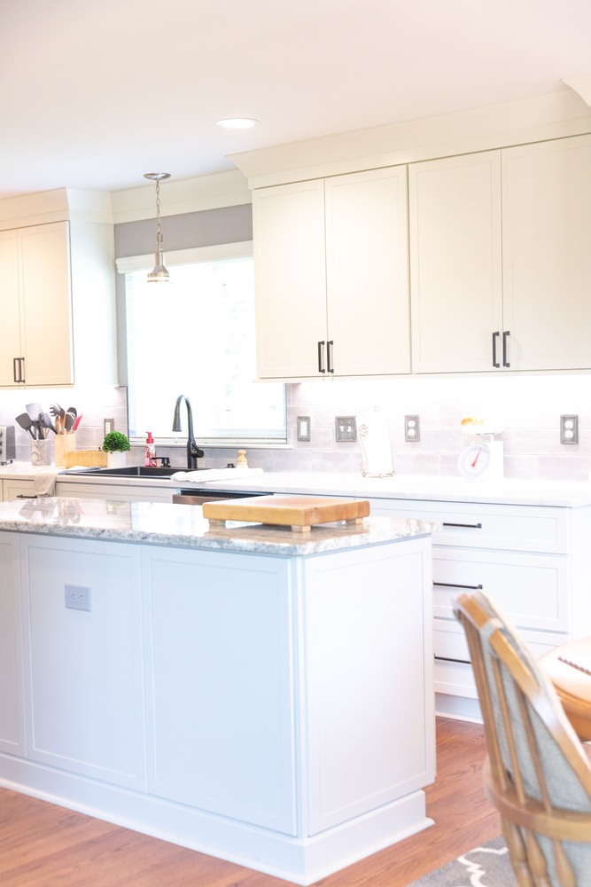 Custom kitchen island with granite countertop and shaker cabinets by Cabinet Creations in Bloomfield Hills, MI