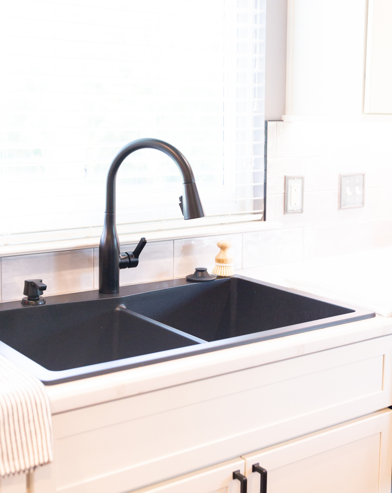 Stylish kitchen remodel with contemporary black sink and shaker cabinetry by Cabinet Creations in Michigan