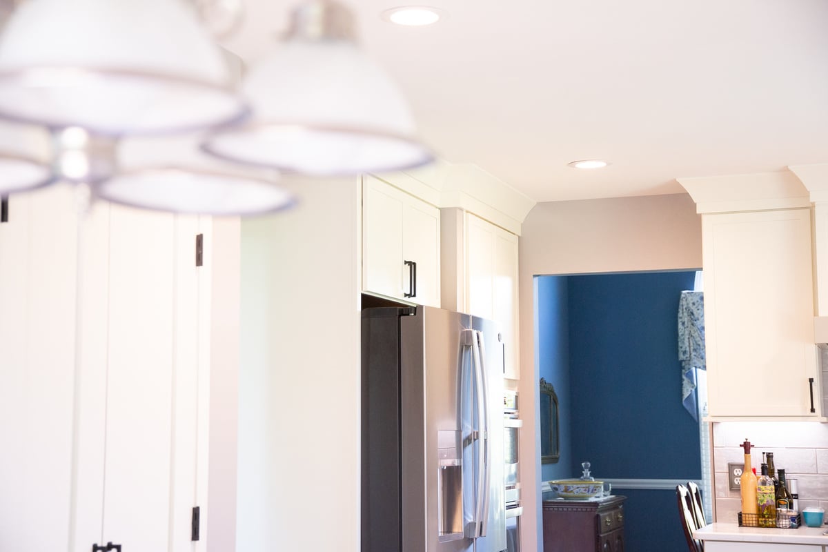Transitional kitchen design featuring white cabinets and crown molding by Cabinet Creations in Oakland County, MI
