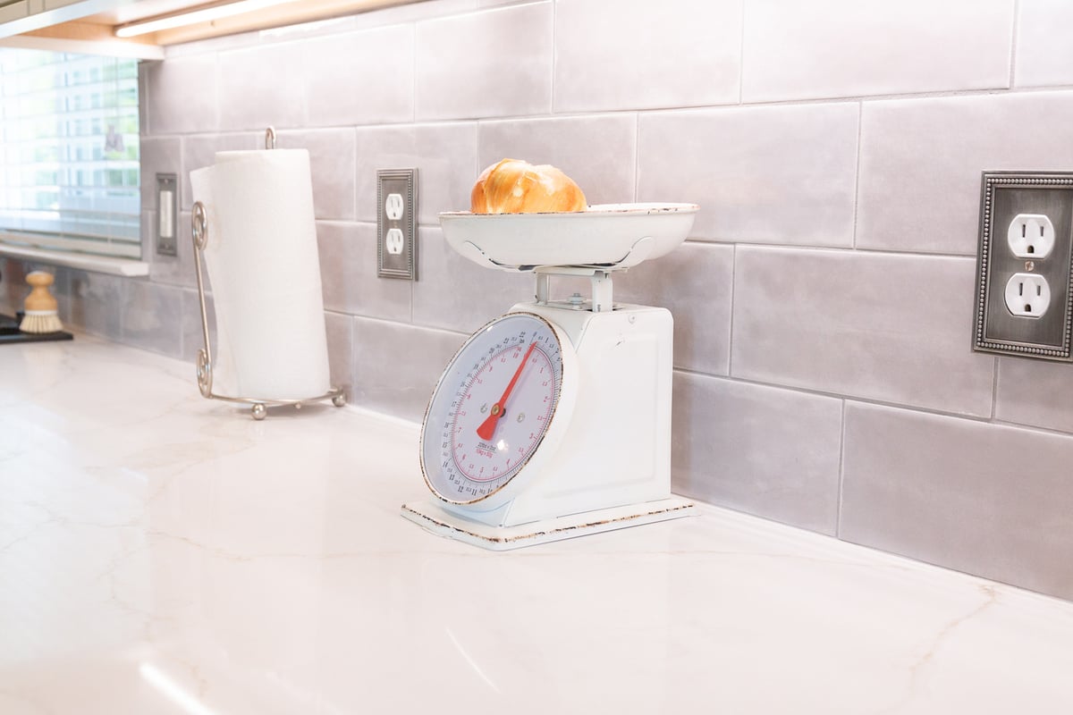 White marble countertop and backsplash in a custom kitchen by Cabinet Creations in Bloomfield Hills, MI