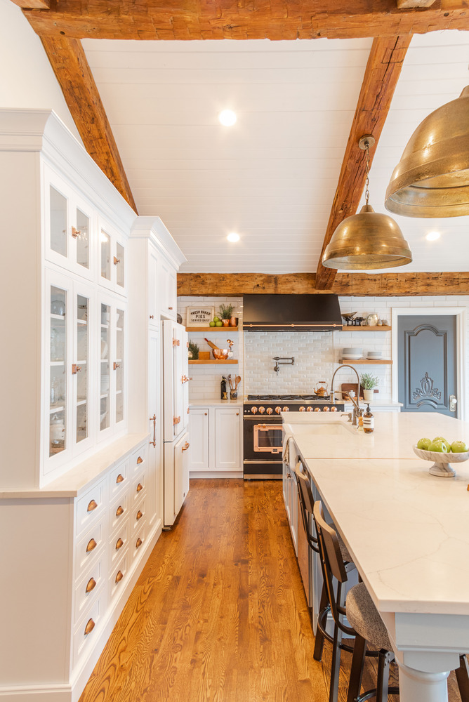 Bright custom kitchen remodel in Waterford Township, MI with vintage-style appliances and open shelving by Cabinet Creations