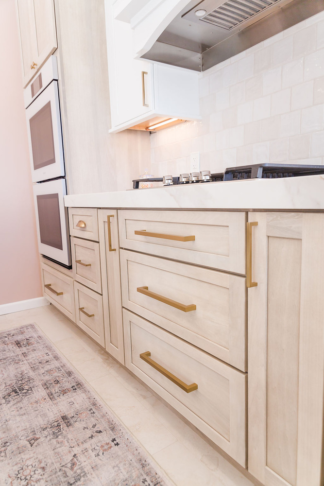 Custom kitchen with light wood drawers and gold hardware by Cabinet Creations in Bloomfield Hills, MI