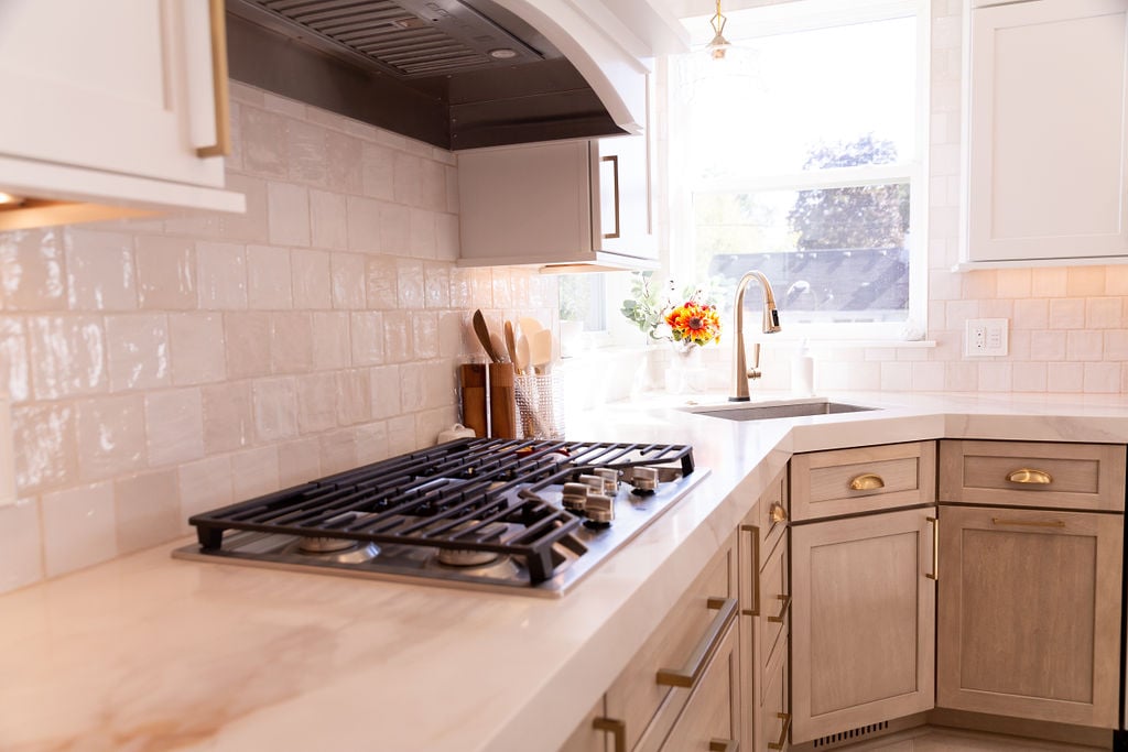 Custom kitchen with tile backsplash and stainless cooktop by Cabinet Creations in Oakland County, MI