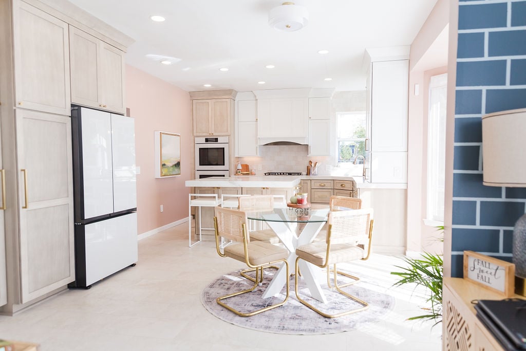 Elegant custom home kitchen and dining area featuring neutral tones by Cabinet Creations in Oakland County, MI