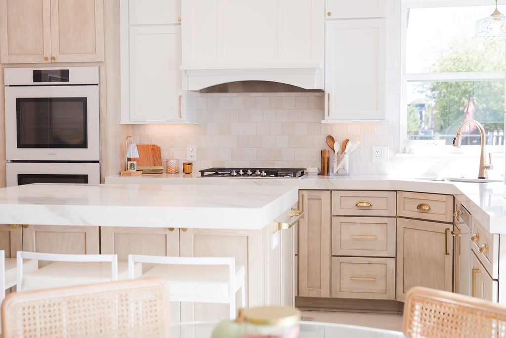 Full view of custom kitchen remodel with white and natural cabinetry by Cabinet Creations in Waterford Township, MI