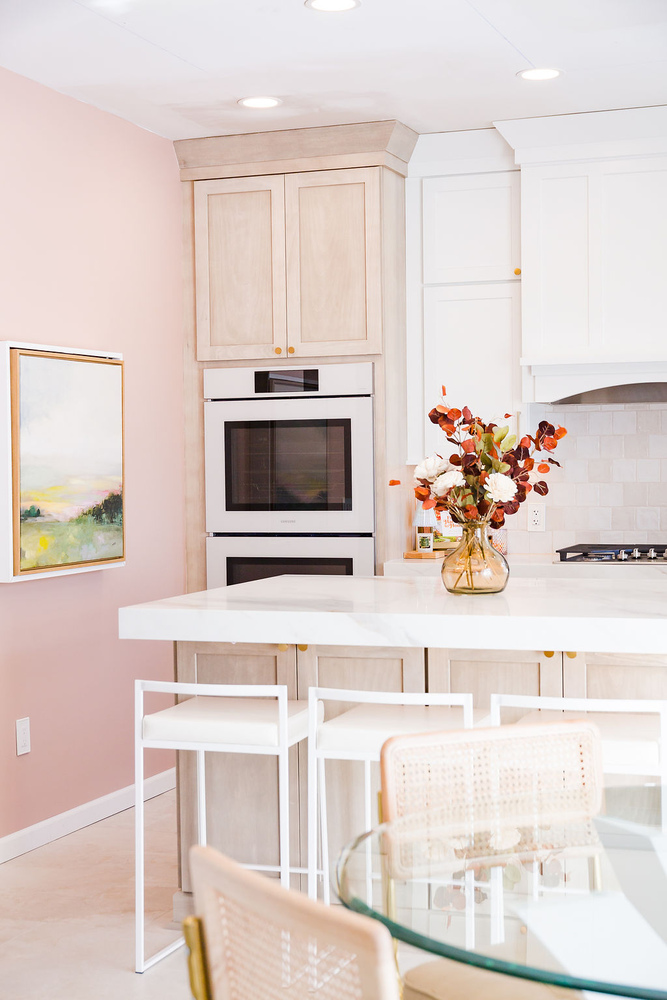 Kitchen island with marble countertop and wood cabinetry by Cabinet Creations in Waterford Township, MI