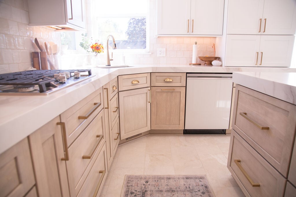 Light and airy custom kitchen with L-shaped cabinetry and quartz counters by Cabinet Creations, Oakland County, MI