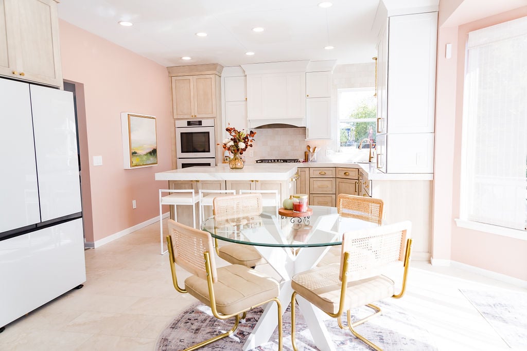 Light and airy kitchen design featuring a modern island and gold accents by Cabinet Creations, Waterford Township, Michigan