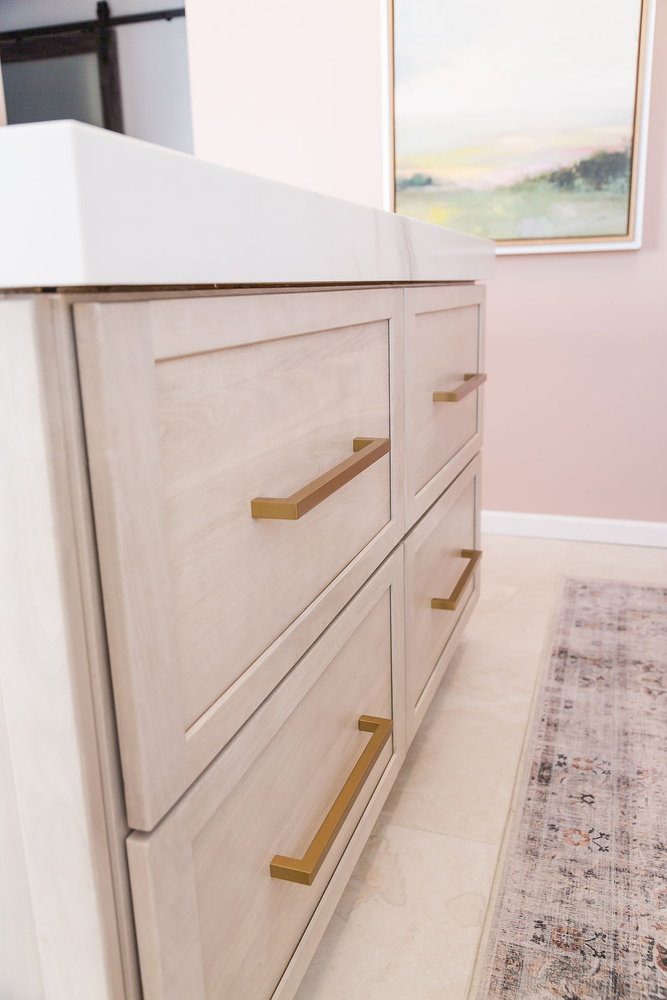 Modern custom kitchen design with warm wood tones and gold accents by Cabinet Creations in Oakland County, MI