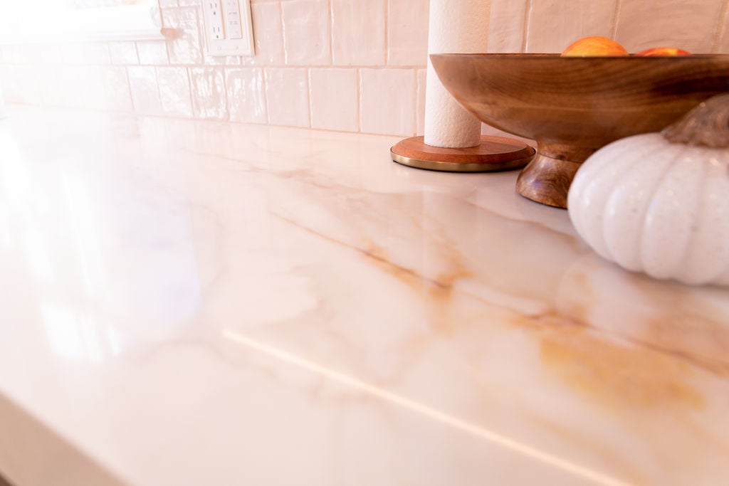 Polished marble-look kitchen countertop installed by Cabinet Creations in Bloomfield Hills, MI