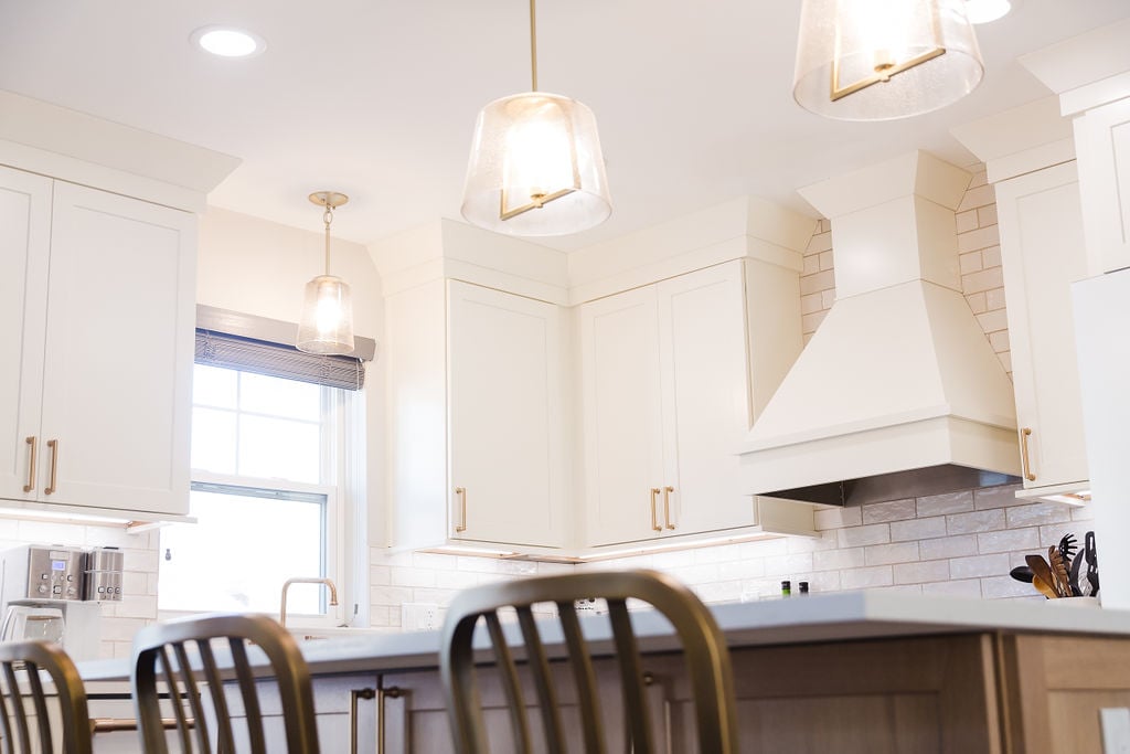 Close-up of white cabinetry and backsplash in a custom kitchen remodel by Cabinet Creations in Ferndale, MI