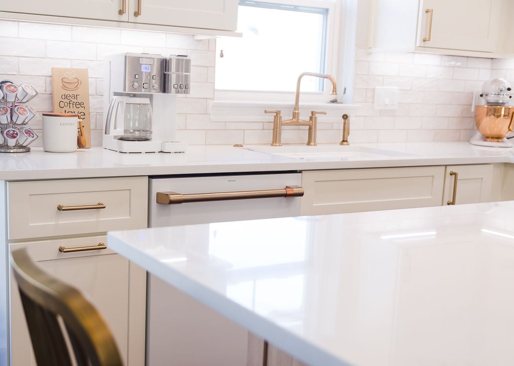 Custom kitchen design featuring coffee station and gold faucet in Oakland County, MI