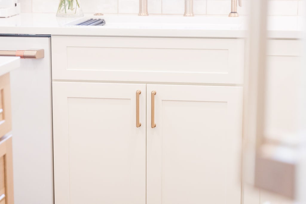 Elegant lower cabinetry design with brass hardware in a Michigan custom kitchen