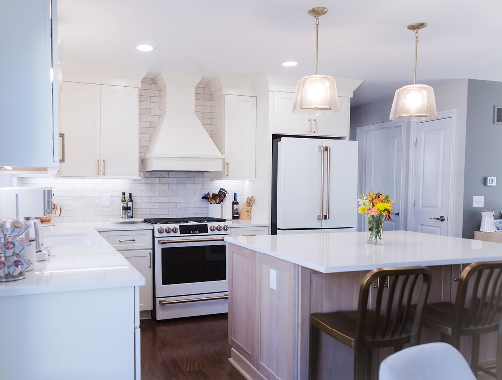 Full custom kitchen view with white cabinets and gold accents by Cabinet Creations in Ferndale, Michigan