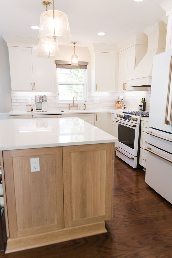 Full kitchen remodel featuring island, pendant lighting, and custom cabinetry by Cabinet Creations in Michigan