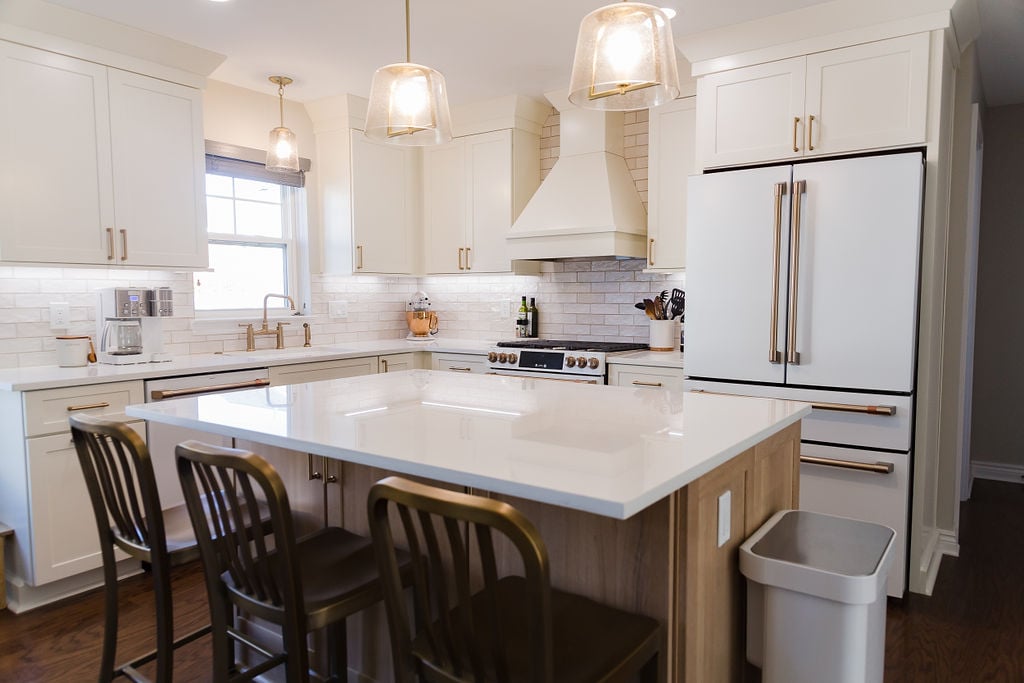 Full kitchen view with white cabinetry and large island by Cabinet Creations in Oakland County, MI