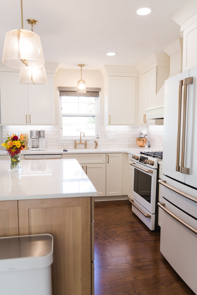 Full kitchen view with white cabinetry and quartz countertops by Cabinet Creations in Bloomfield Hills, MI
