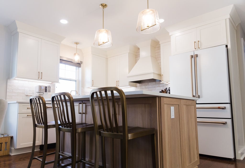 Modern custom kitchen remodel by Cabinet Creations in Ferndale, MI featuring white cabinets and a wood island