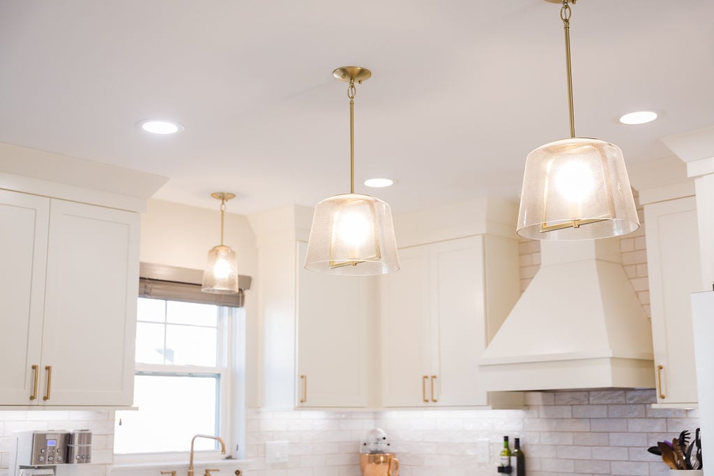 Pendant lighting over custom kitchen island by Cabinet Creations in Oakland County, MI