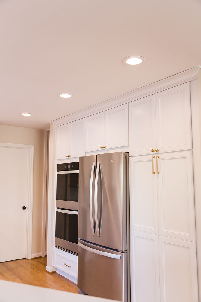 Side view of double oven and fridge wall in Cabinet Creations custom kitchen in Waterford Township, MI