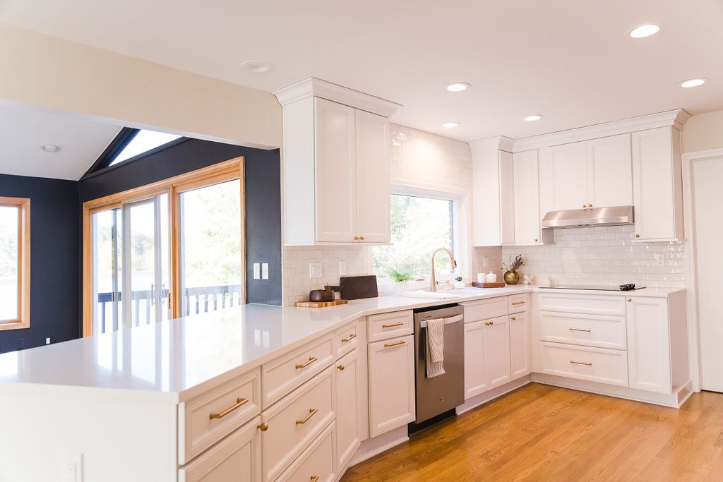 Wide-angle kitchen photo featuring custom cabinetry and golden drawer pulls by Cabinet Creations, Oakland County, MI