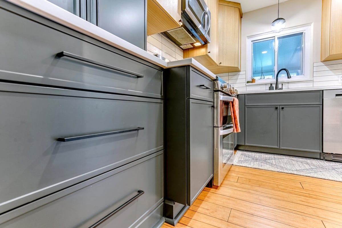 Waterford, MI kitchen remodel with integrated microwave and stove in open layout by Cabinet Creations
