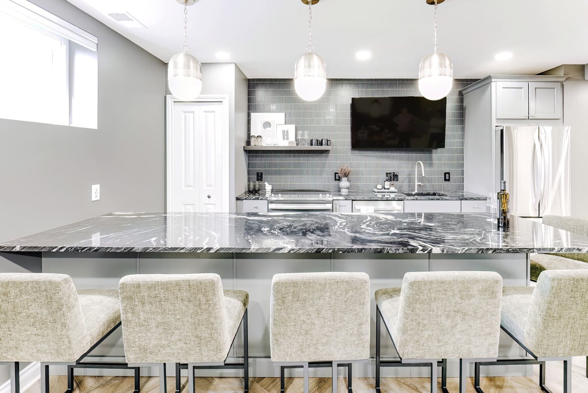 Cabinet Creations custom bar with seating and pendant lighting in Clarkston, MI