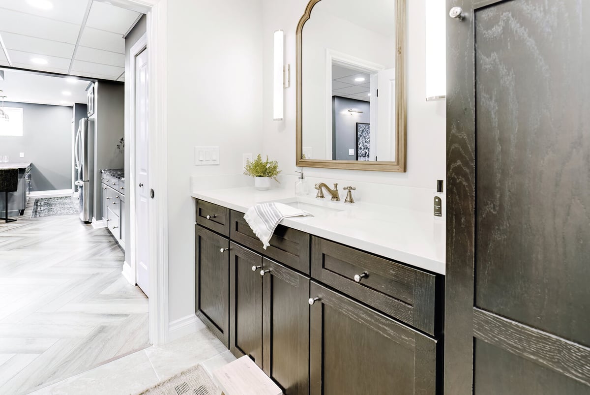 View of bathroom cabinetry and design flowing into basement bar area by Cabinet Creations in Clarkston