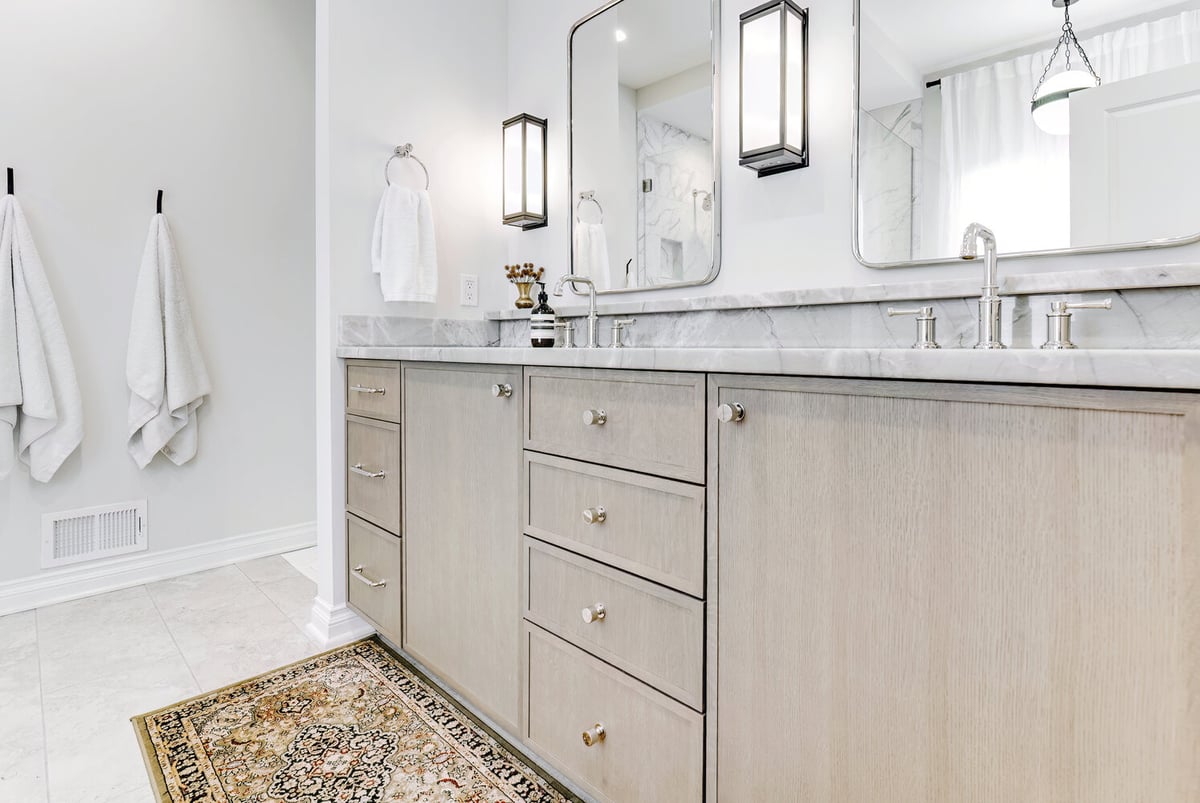 Spacious master bath with dual vanities and modern lighting in Waterford Township, Michigan