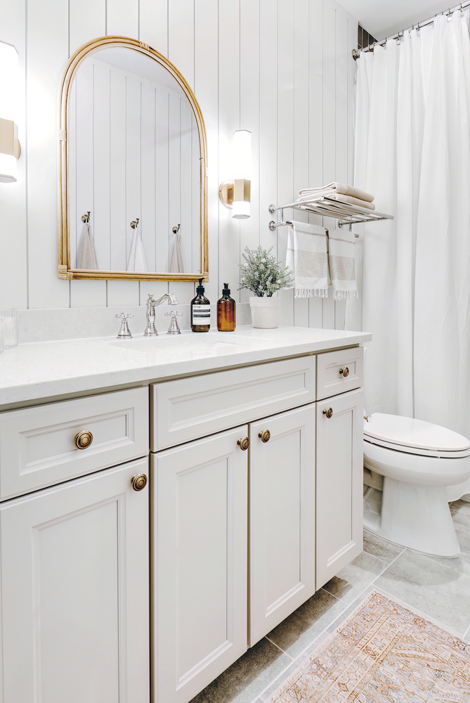 right bathroom vanity with classic hardware and quartz top in Clarkston home by Cabinet Creations