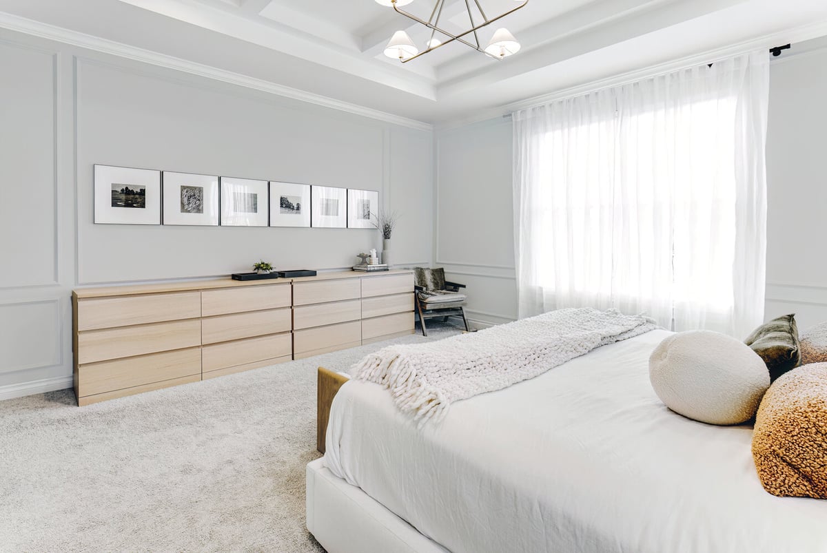 Bright custom bedroom with wall-to-wall dresser by Cabinet Creations in Farmington, MI