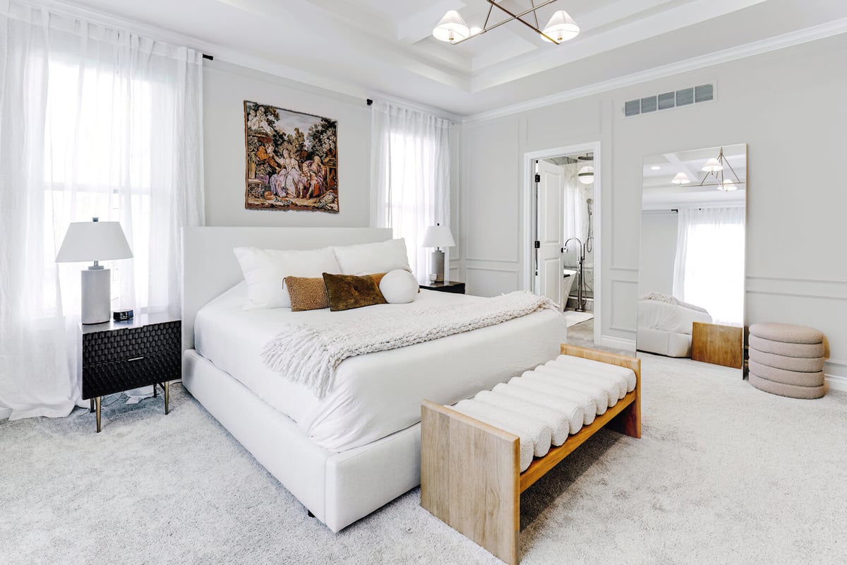 Master bedroom retreat with plush carpet and neutral decor by Cabinet Creations in Oxford, MI