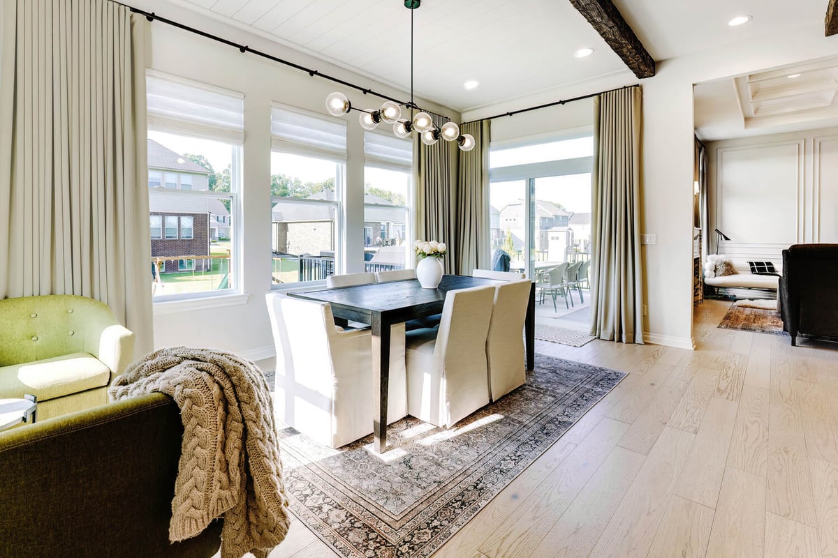 Elegant dining space with backyard views in a Wolverine Lake, MI custom home