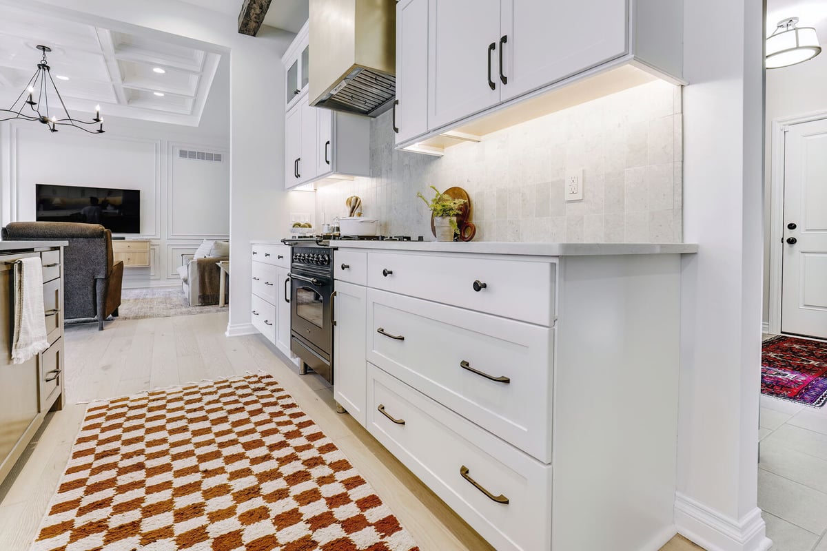 Contemporary kitchen design with decorative backsplash and warm tones by Cabinet Creations in Clawson, MI