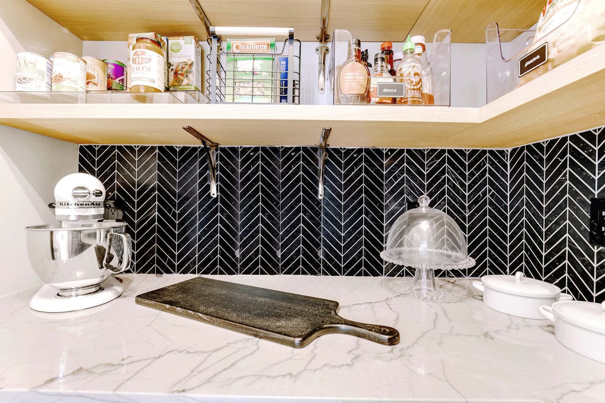 Custom pantry countertop with marble surface and KitchenAid mixer by Cabinet Creations in Oakland County, MI