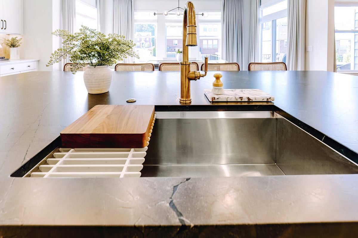 Front view of island sink and faucet in a custom kitchen by Cabinet Creations, Oakland County, MI