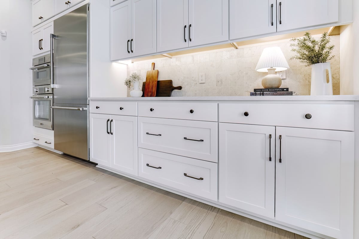 Lower cabinet view with under-cabinet lighting and custom pulls in Auburn Hills, MI