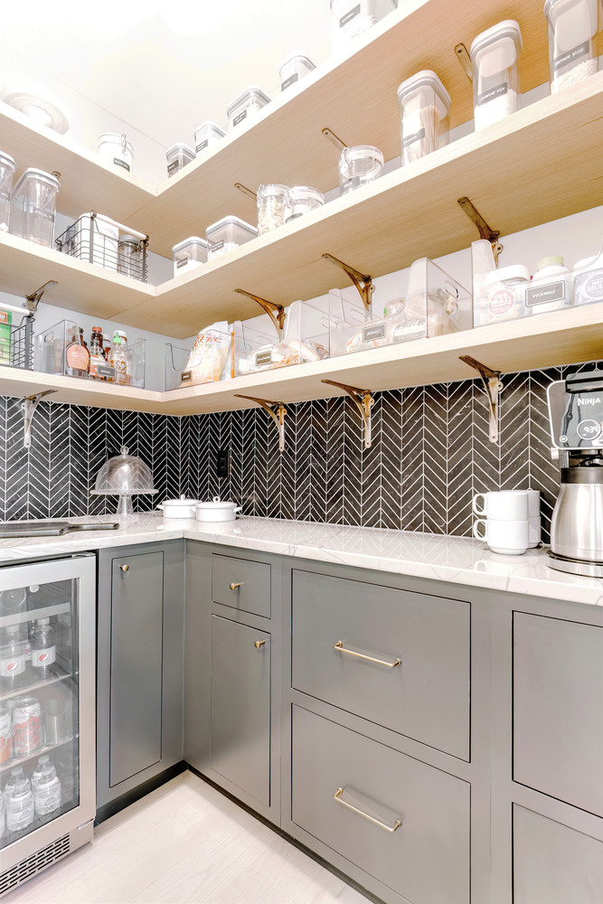 Organized walk-in pantry with labeled containers in a custom home by Cabinet Creations in Oakland County, MI