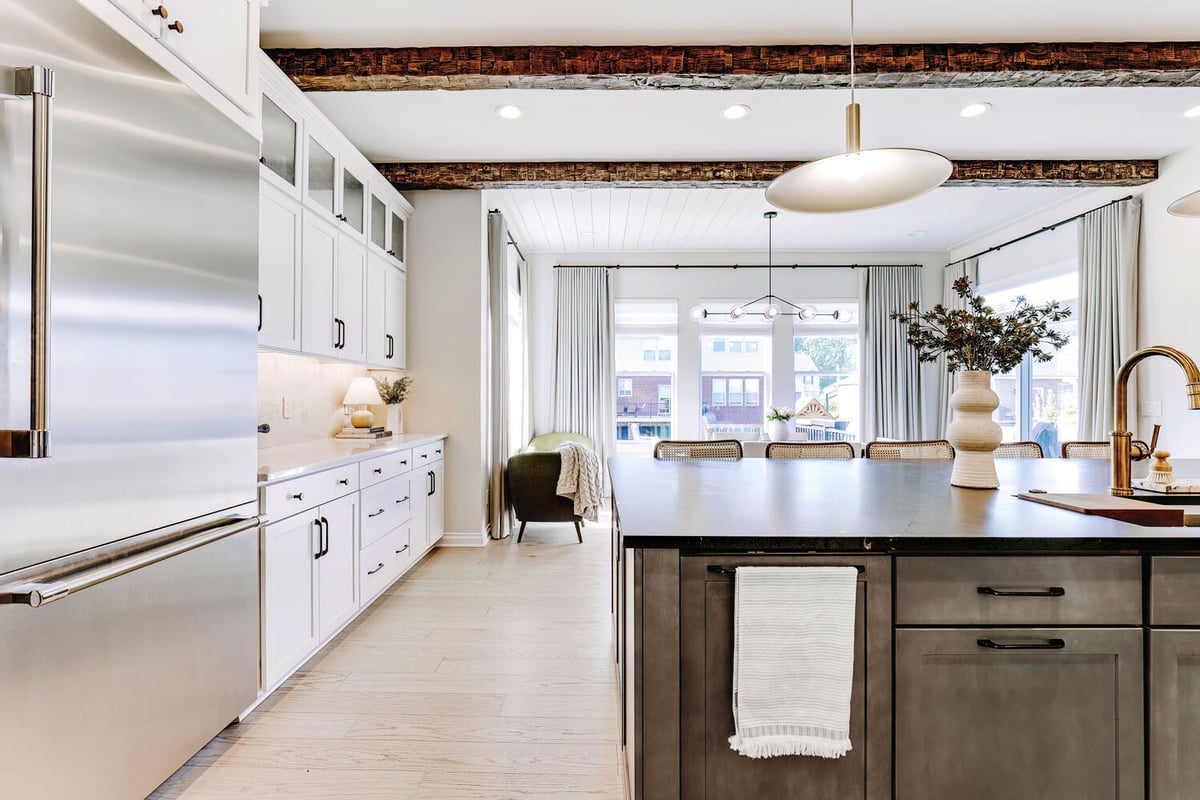 Spacious custom kitchen with wood ceiling beams and oversized island in Bloomfield Hills, MI