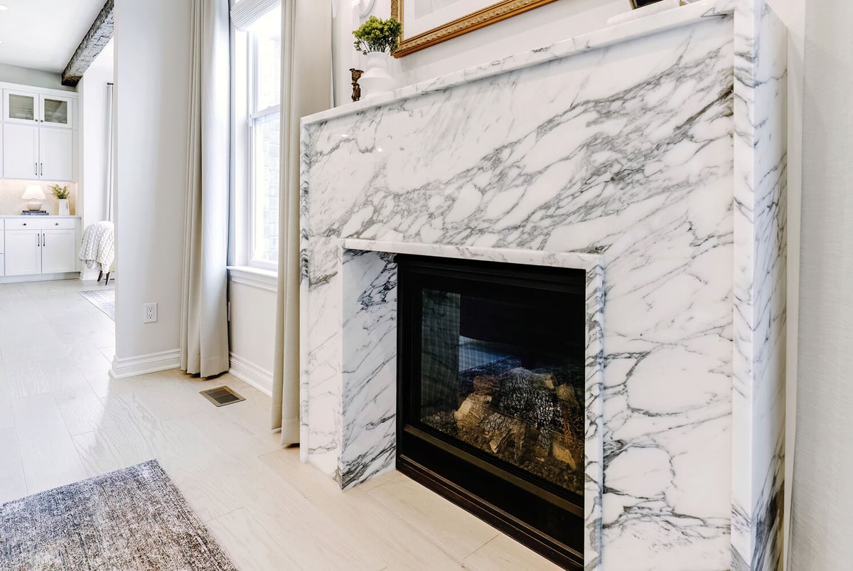 Custom fireplace detail in open concept living room by Cabinet Creations in Oakland County, MI
