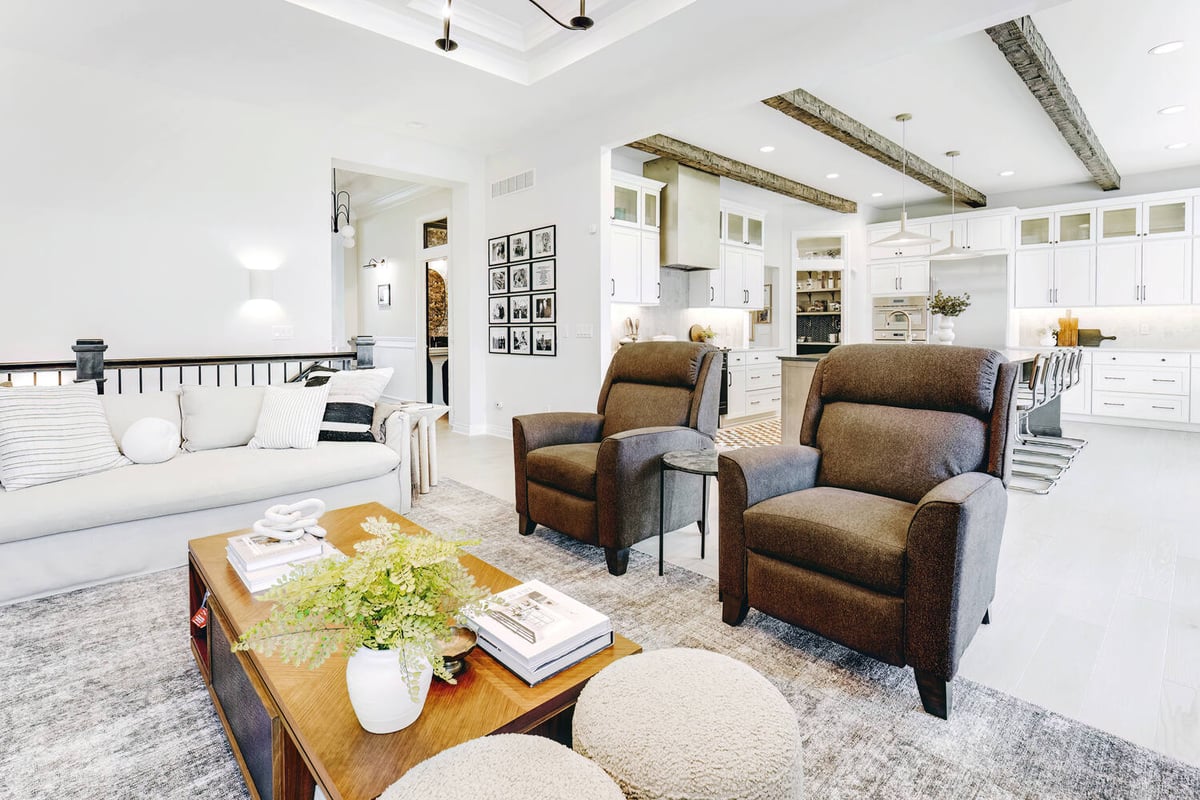 Transitional living space with plush seating and exposed beams by Cabinet Creations, Oakland County, MI